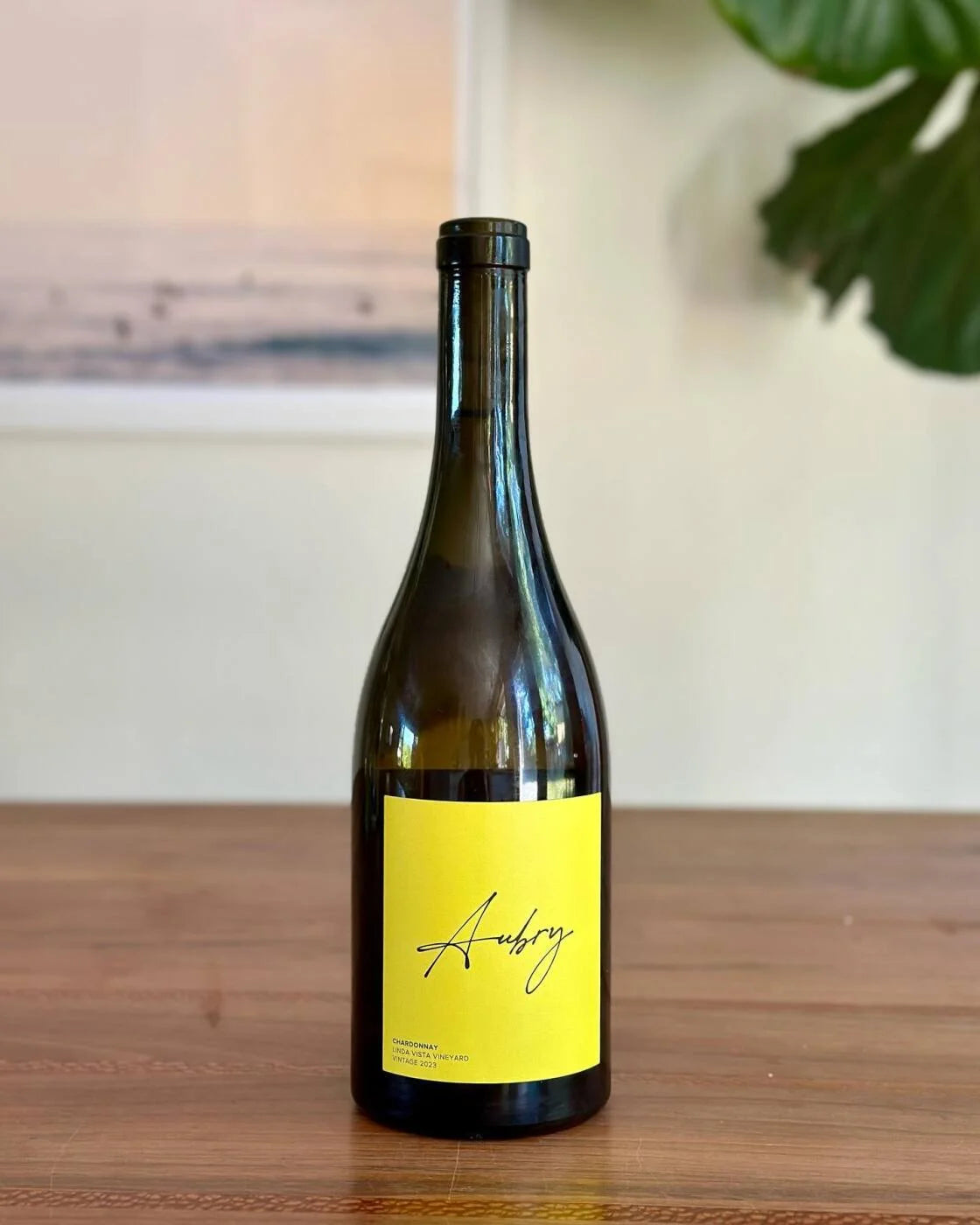Bottle of Aubry Wines Oak Knoll Chardonnay with minimal label, set against a neutral background
